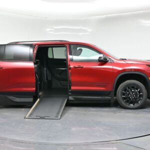 Red minivan with a lowered side ramp for wheelchair access and doors open, showing the interior seating area.