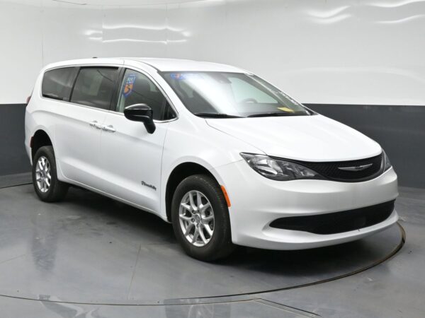 wav-2C4RC1CGXRR118735-0 White Chrysler Pacifica minivan in a studio setting, angled to show front and passenger side.