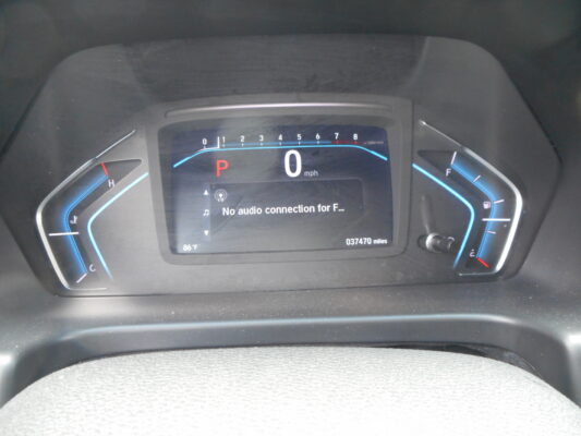 Vehicle dashboard: gear in P, speed is 0 mph, odometer reads 37,470 miles, outside temp 86°F, no audio connection message.