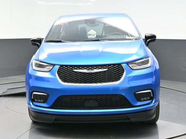 wav-2C4RC1BGXTR202255-1 Front view of a blue SUV with a black honeycomb grille and angular LED headlights in a studio setting.