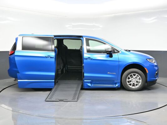 Blue BraunAbility wheelchair-accessible minivan with ramp extended for wheelchair access